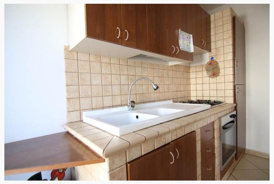 Kuchyň nebo kuchyňský kout v ubytování Villette Ninfee