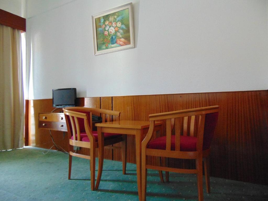TV a/nebo společenská místnost v ubytování Hellas Hotel