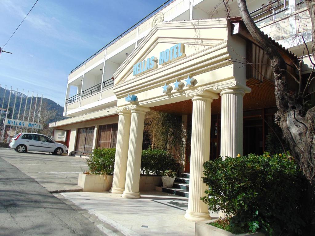 a building with columns in front of a building at Hellas Hotel in Kakopetria