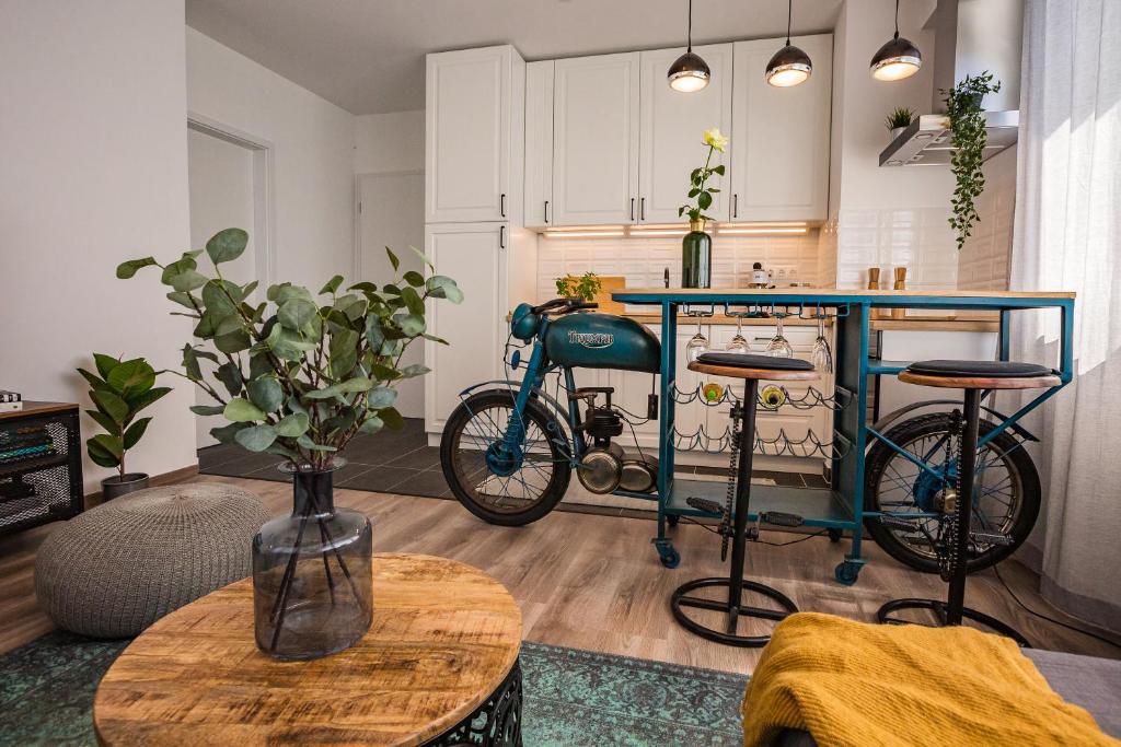 a kitchen with a blue bike in a kitchen at Stylish Oasis Central Apartment with AC and Parking in Budapest