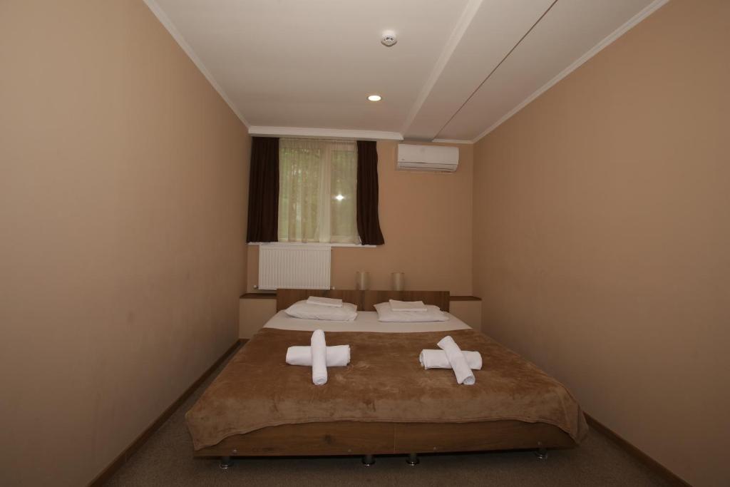 Postel nebo postele na pokoji v ubytování Hotel Reverence