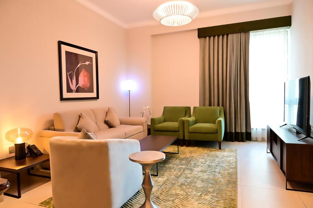 TV o dispositivi per l'intrattenimento presso Retaj Baywalk Residence