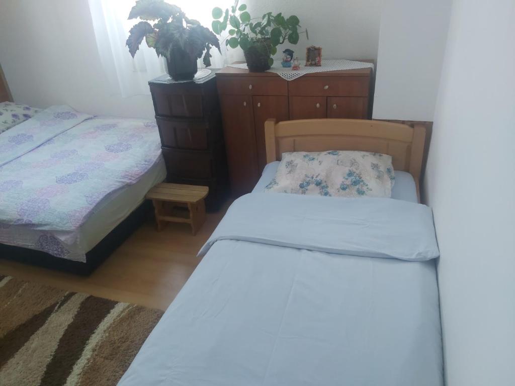 Postel nebo postele na pokoji v ubytování Apartman Idžo