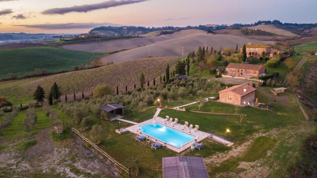 an aerial view of an estate with a swimming pool at VILLA LAJATICO Farmhouse with Private Pool in Peccioli