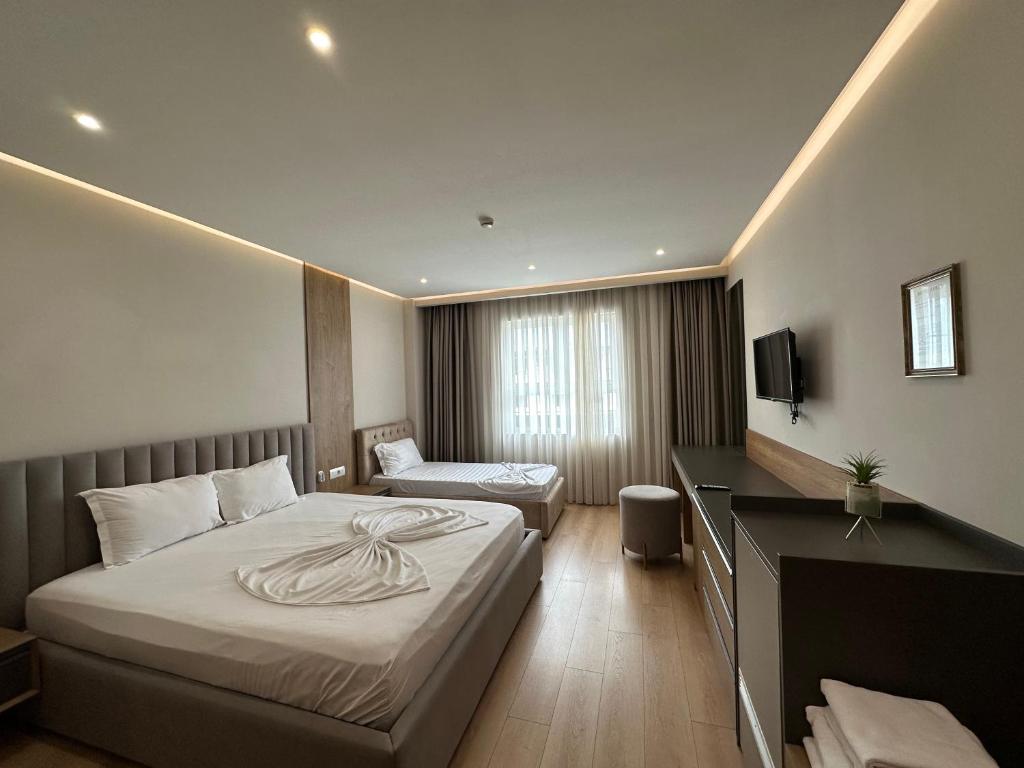 Postel nebo postele na pokoji v ubytování Hotel Colis