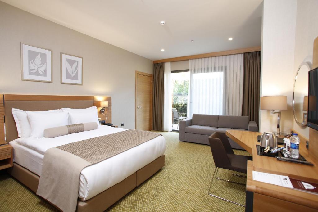 Postel nebo postele na pokoji v ubytování Mia City Hotel