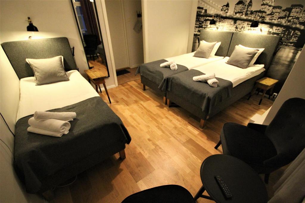 Vattengrändens Vandrarhem & Hotel Norrköping - Driepersoonskamer Met Gedeeld Toilet