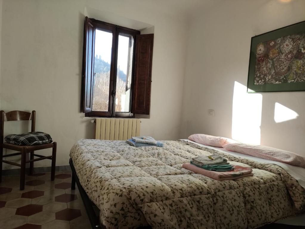 A bed or beds in a room at Il ristoro del viandante
