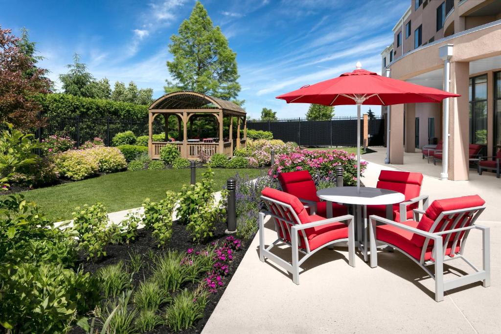 a patio with a table and chairs and a gazebo at Courtyard Bethlehem Lehigh Valley/I-78 in Bethlehem