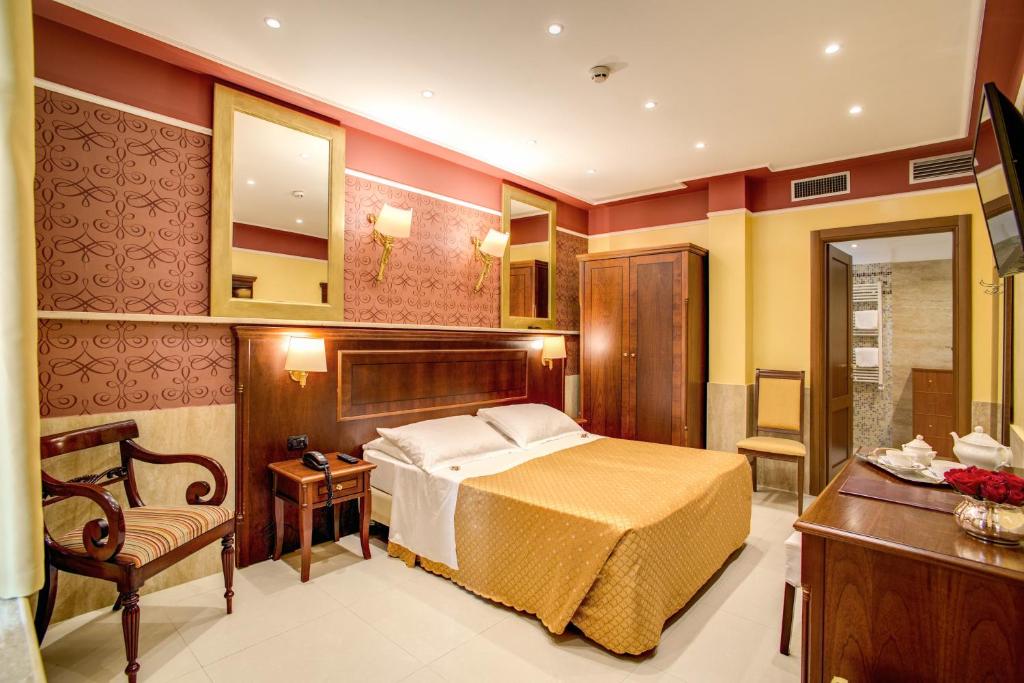 A bed or beds in a room at Aurelius Art Gallery Hotel