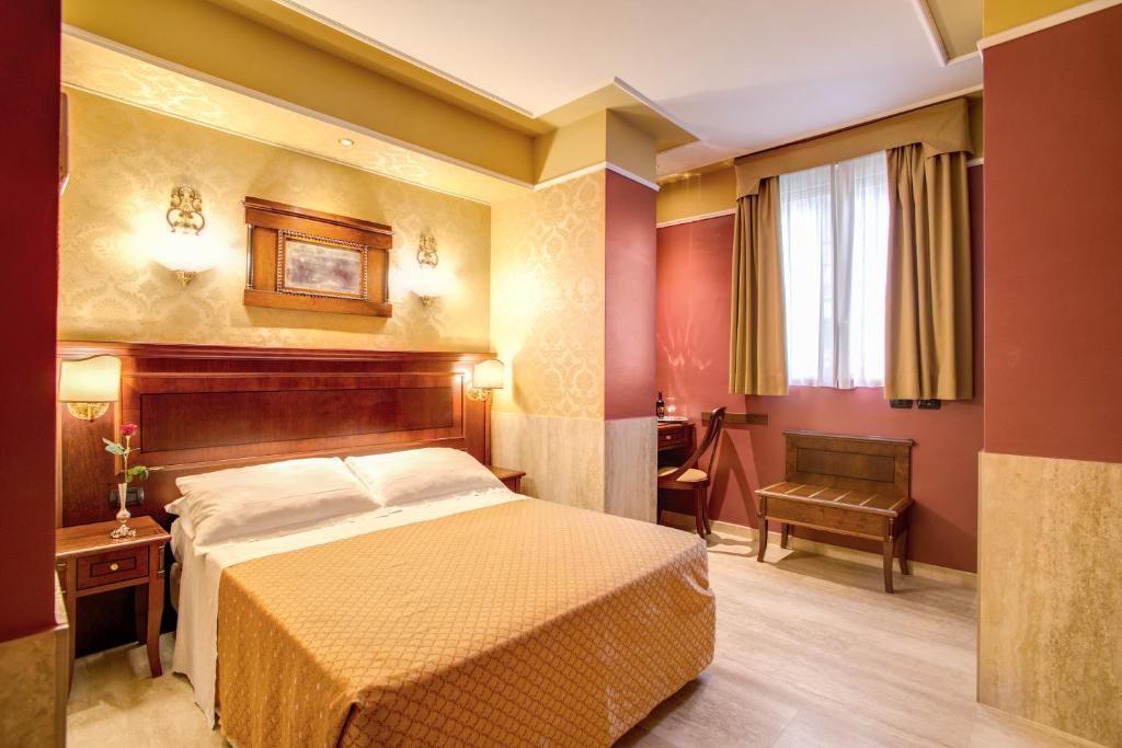 A bed or beds in a room at Aurelius Art Gallery Hotel