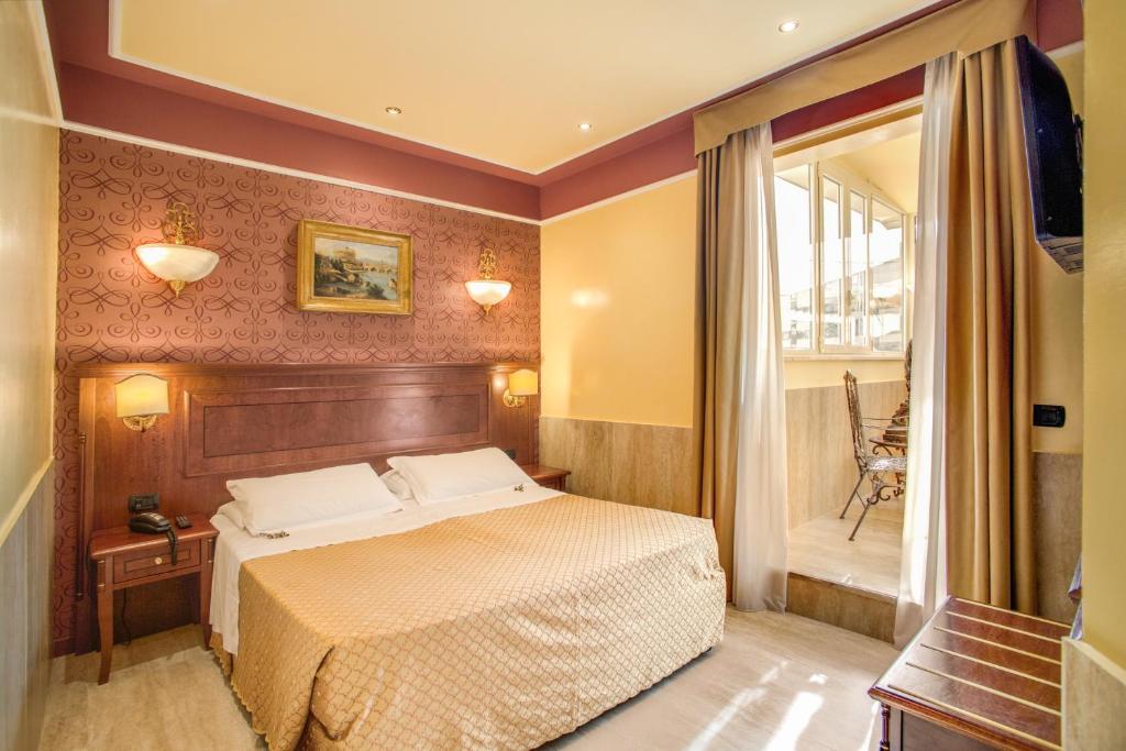 A bed or beds in a room at Aurelius Art Gallery Hotel