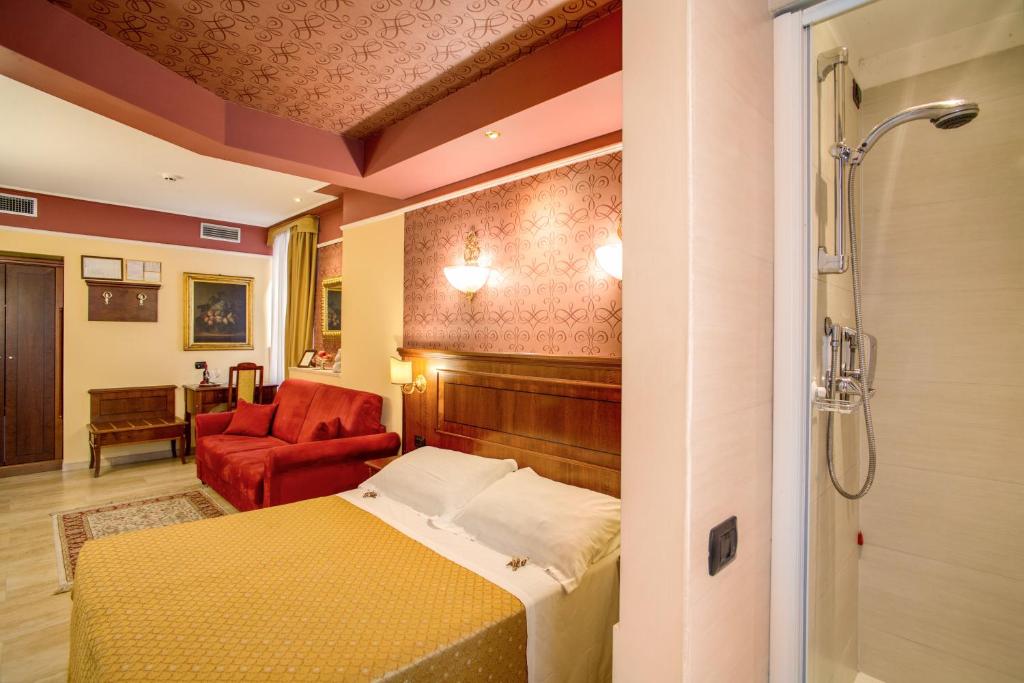 A bed or beds in a room at Aurelius Art Gallery Hotel