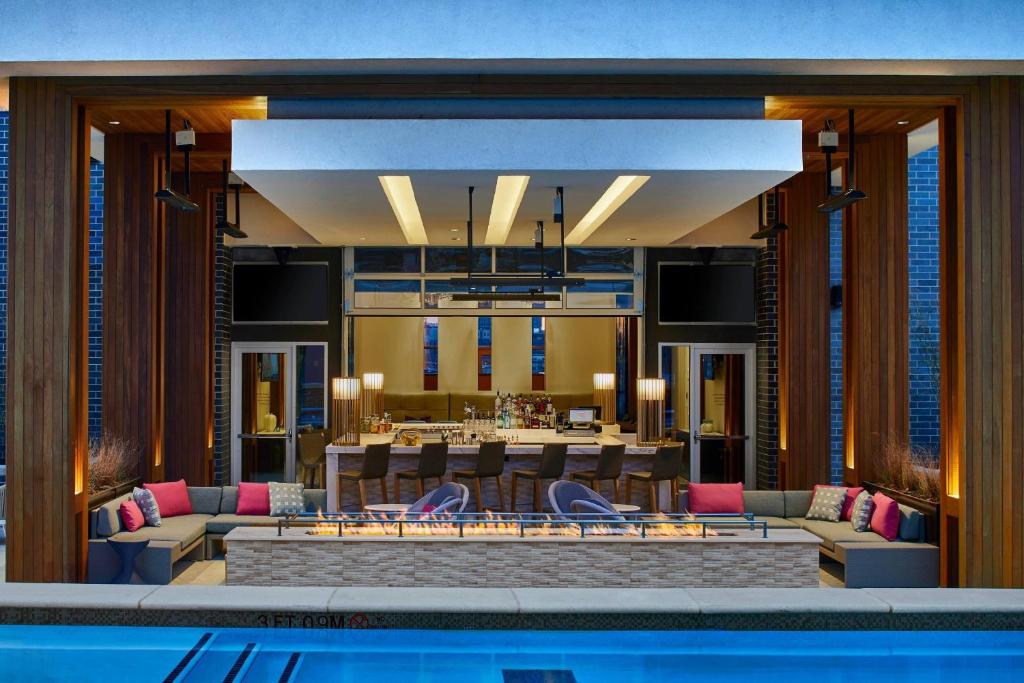 a hotel lobby with a pool and a restaurant at Residence Inn by Marriott Nashville Downtown/Convention Center in Nashville