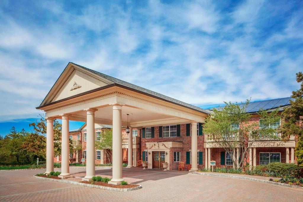 a large brick building with a large gazebo at Residence Inn by Marriott West Orange in West Orange
