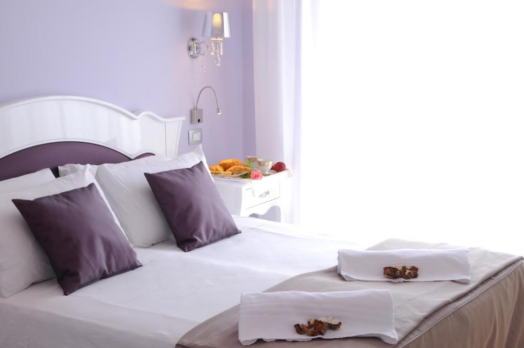 Postel nebo postele na pokoji v ubytování Hotel I Due Cigni