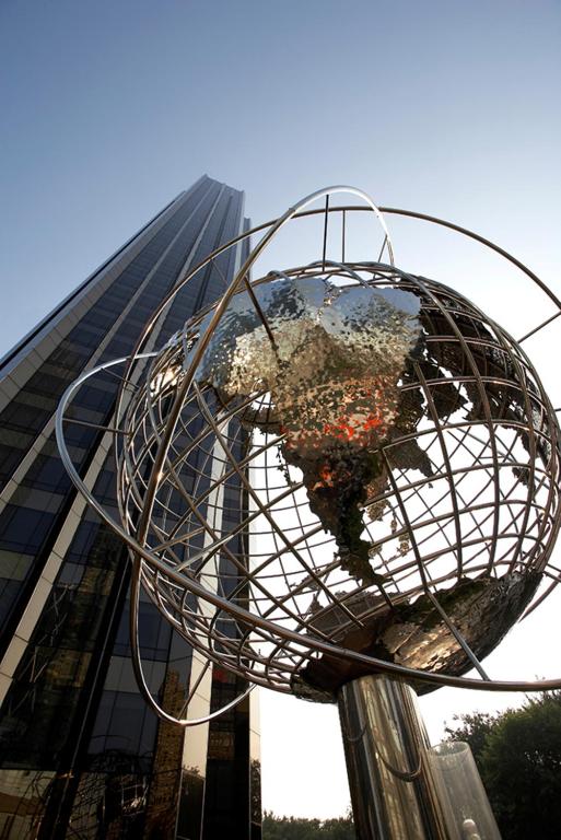 a metal globe on a pole in front of a building at Trump International New York in New York