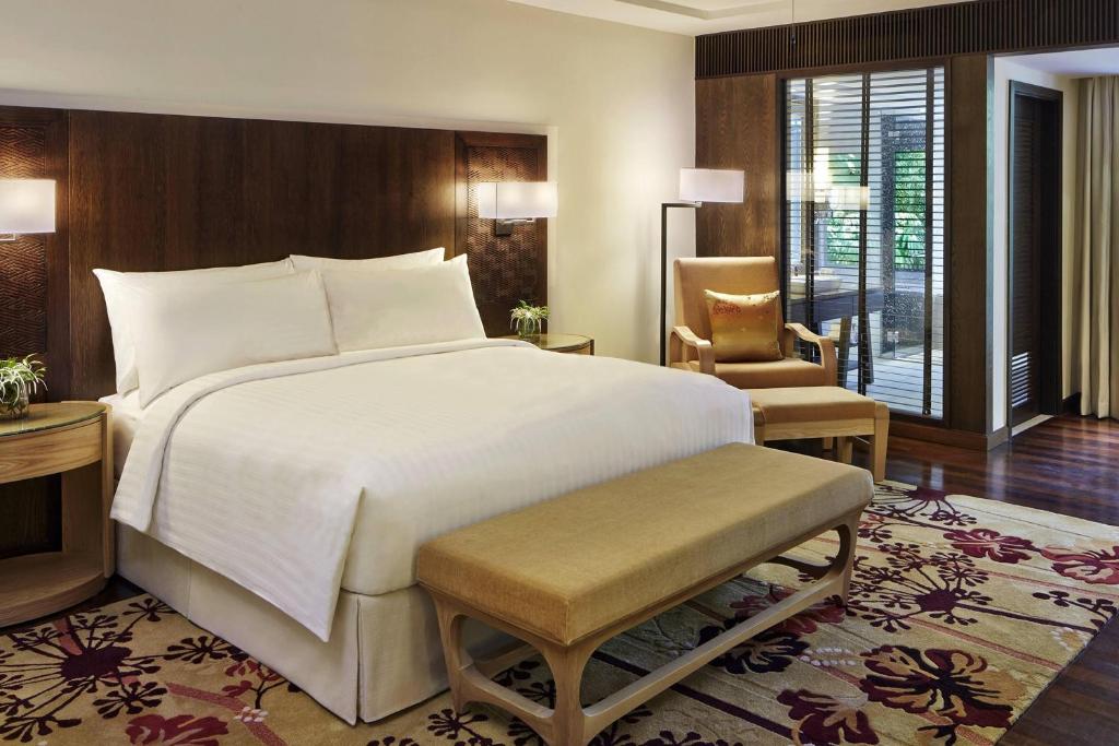 Postel nebo postele na pokoji v ubytování Mulu Marriott Resort