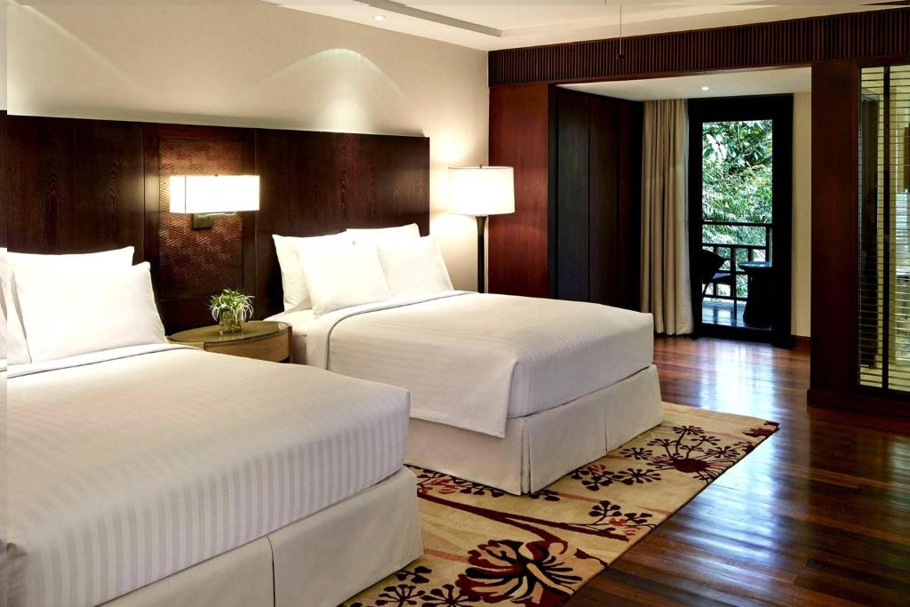 Postel nebo postele na pokoji v ubytování Mulu Marriott Resort