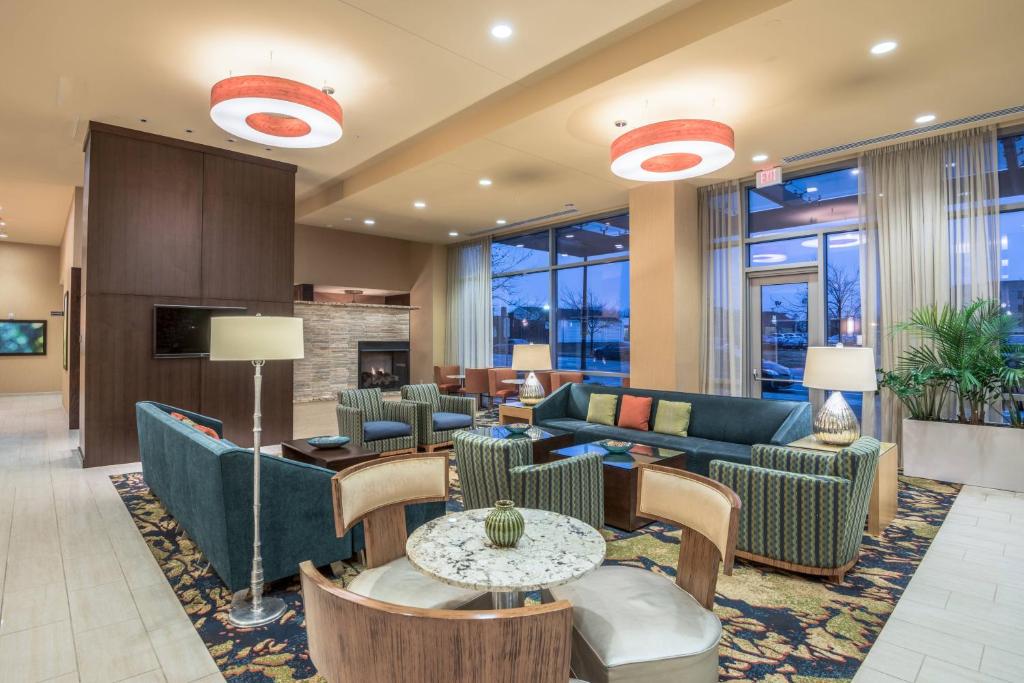 a hotel lobby with couches and tables and chairs at Residence Inn by Marriott Arlington Ballston in Arlington