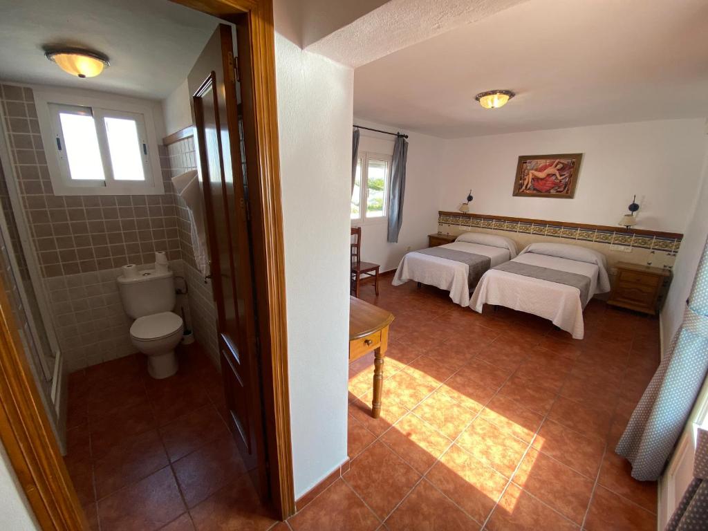 Postel nebo postele na pokoji v ubytování Hotel Simón