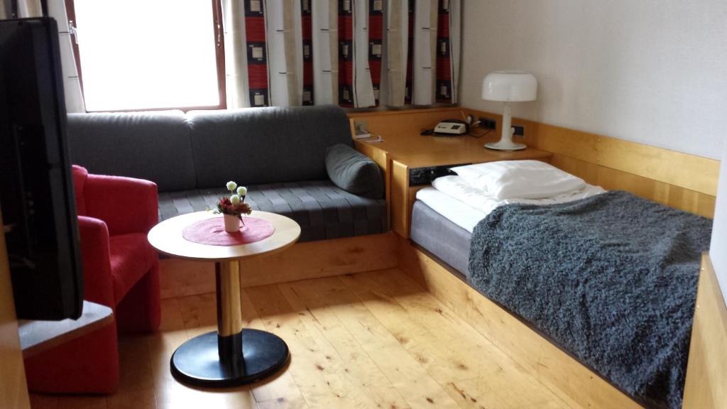 Postel nebo postele na pokoji v ubytování Hotell Toppen