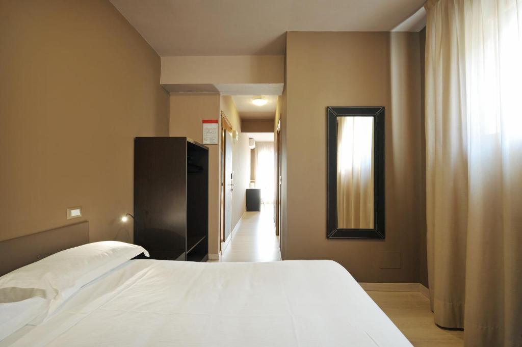 Postel nebo postele na pokoji v ubytování M14 Hotel & Spa