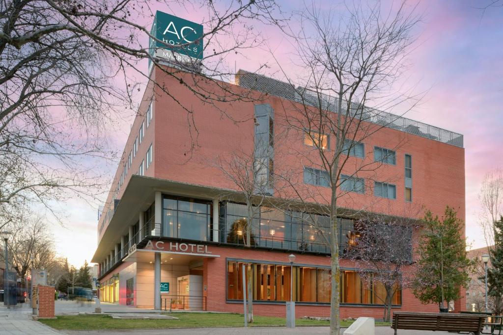 a building with a hotel sign on top of it at AC Hotel Guadalajara by Marriott, Spain in Guadalajara