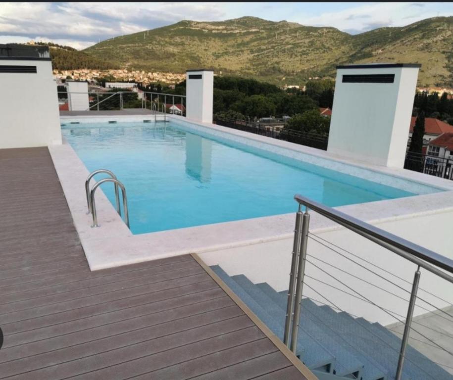 a large swimming pool on top of a building at Apartman Cristal LUX in Trebinje