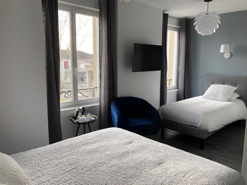 Postel nebo postele na pokoji v ubytování Hôtel de la Glane