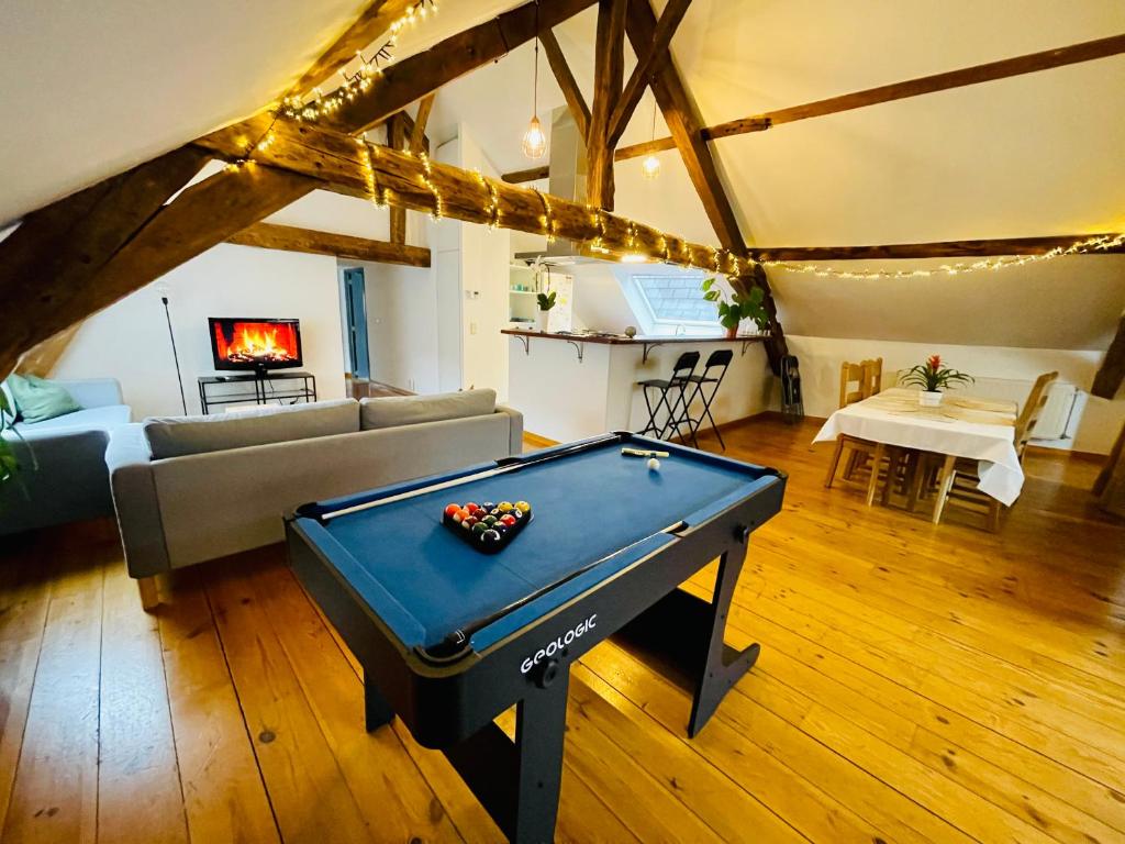 a living room with a pool table and a couch at Down Town Spacious Loft with Private Parking in Brussels