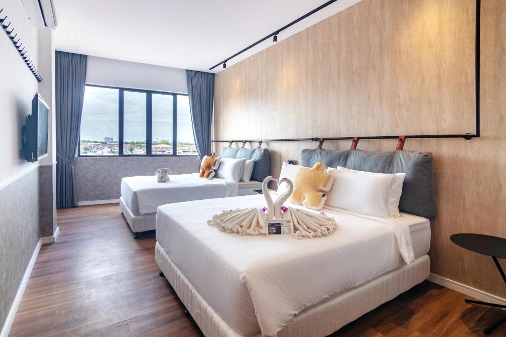 Voodi või voodid majutusasutuse Bagan Suite toas