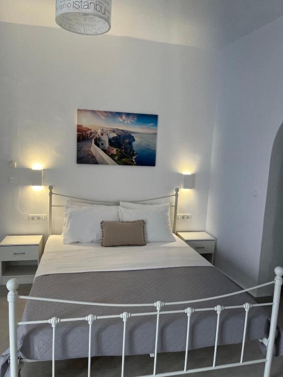 Postel nebo postele na pokoji v ubytování Firaxenia rooms