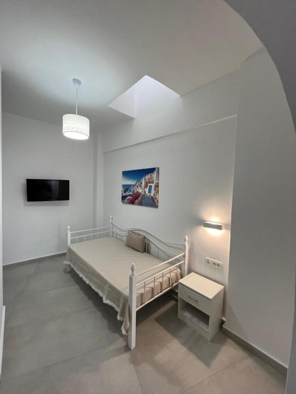 Postel nebo postele na pokoji v ubytování Firaxenia rooms