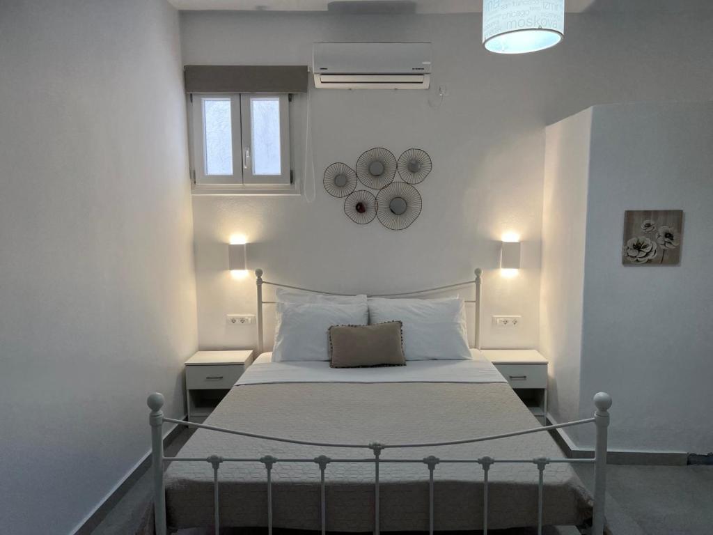 Postel nebo postele na pokoji v ubytování Firaxenia rooms