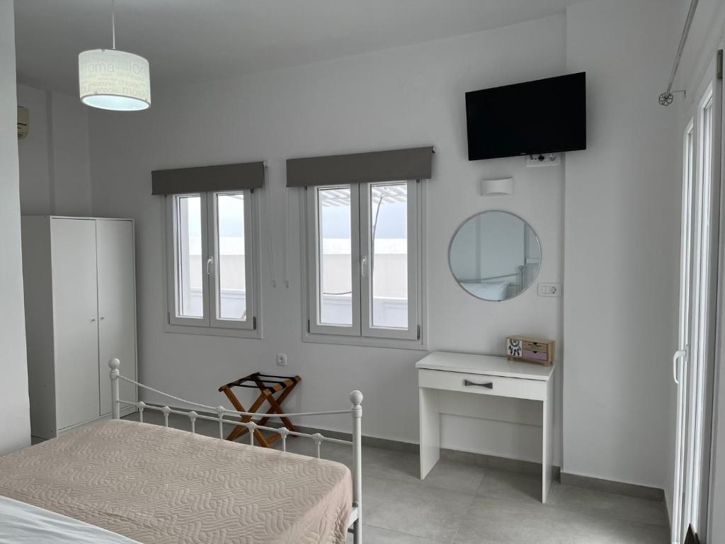 TV a/nebo společenská místnost v ubytování Firaxenia rooms