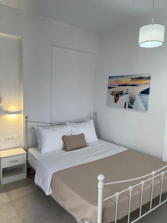 Postel nebo postele na pokoji v ubytování Firaxenia rooms