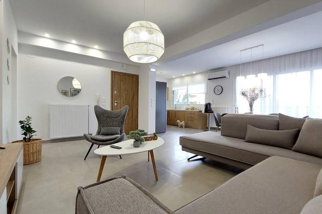 a living room with a couch and a table at Koroni House in Heraklio Town