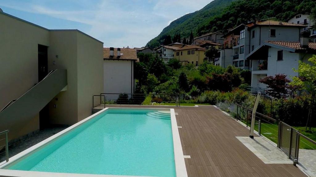 a swimming pool in the backyard of a house at Vista Panorama Jewel - Acquaseria, San Siro by LoveComo in San Siro