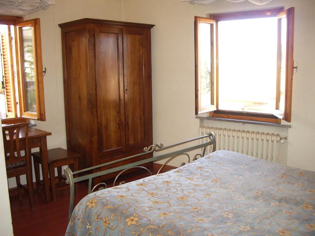 Postel nebo postele na pokoji v ubytování Albergo Villa Sorriso