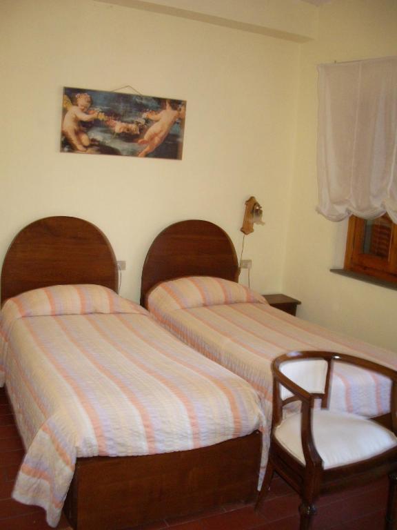 Postel nebo postele na pokoji v ubytování Albergo Villa Sorriso