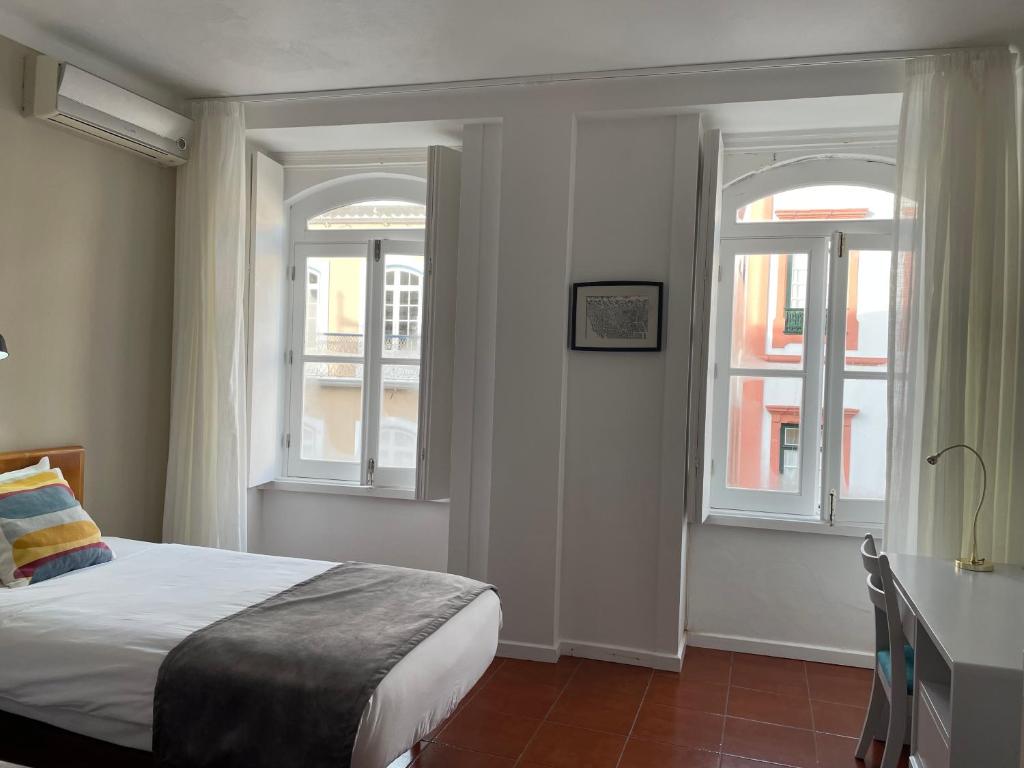 Postel nebo postele na pokoji v ubytování Hotel Ilha
