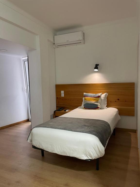 Postel nebo postele na pokoji v ubytování Hotel Ilha