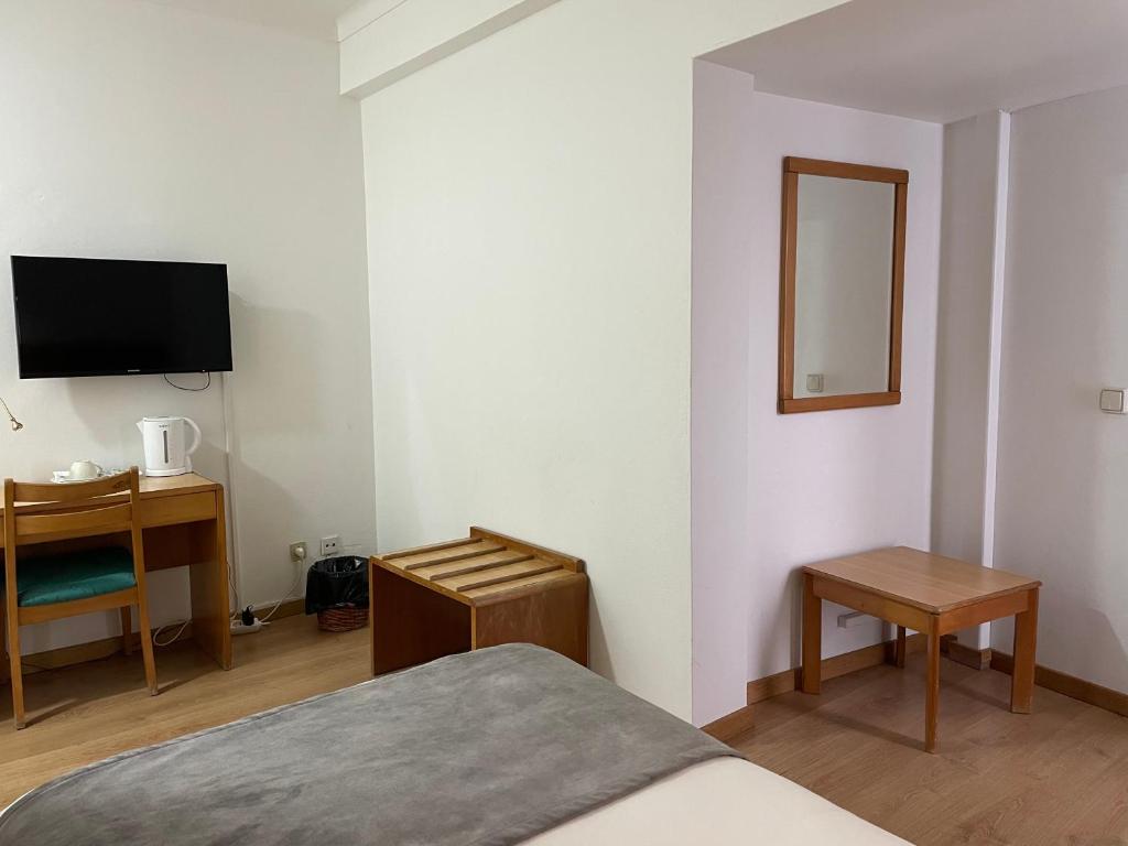 TV a/nebo společenská místnost v ubytování Hotel Ilha