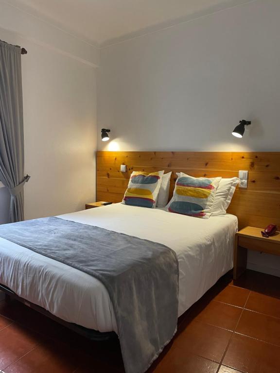 Postel nebo postele na pokoji v ubytování Hotel Ilha