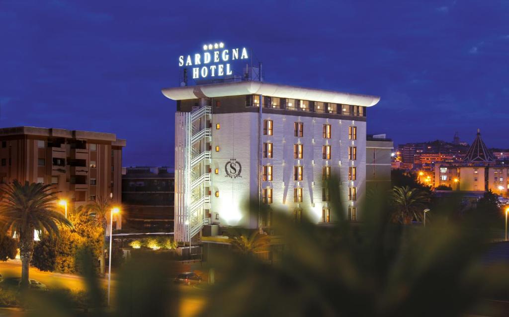 a large clock tower in the middle of a city at Sardegna Hotel - Suites & Restaurant in Cagliari
