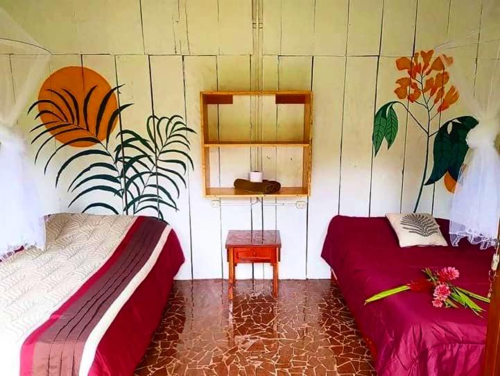 Postel nebo postele na pokoji v ubytování Cabañas Ixaya