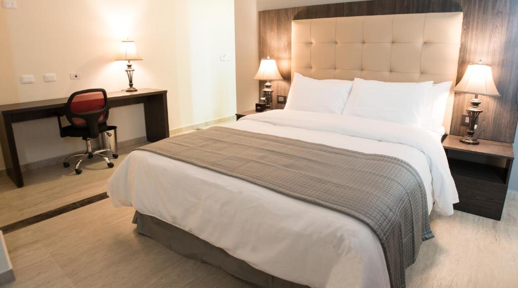 Postel nebo postele na pokoji v ubytování Hotel HR AMADA Cúcuta