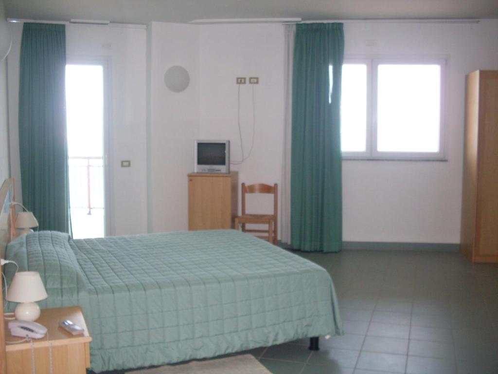 Postel nebo postele na pokoji v ubytování Hotel Soleado
