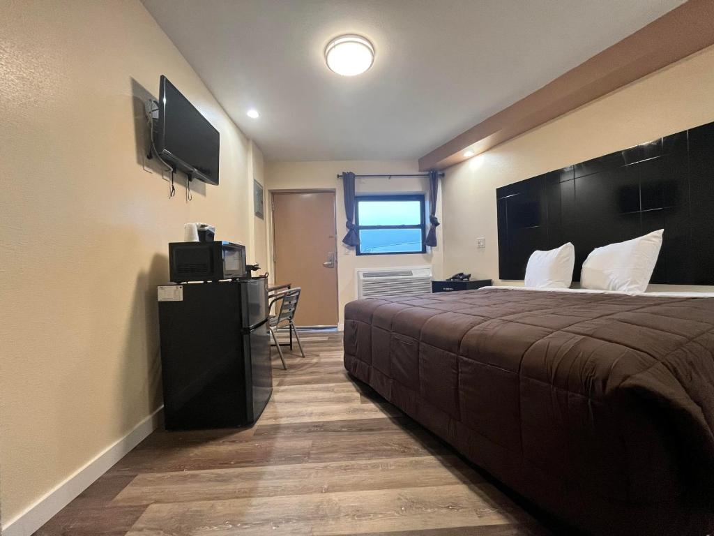 TV a/nebo společenská místnost v ubytování Circle Motor Lodge